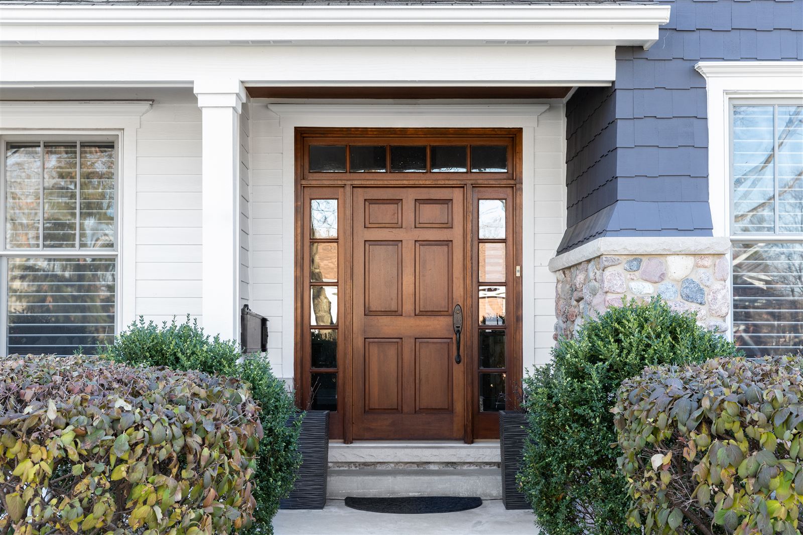 Wood front door on a finished home