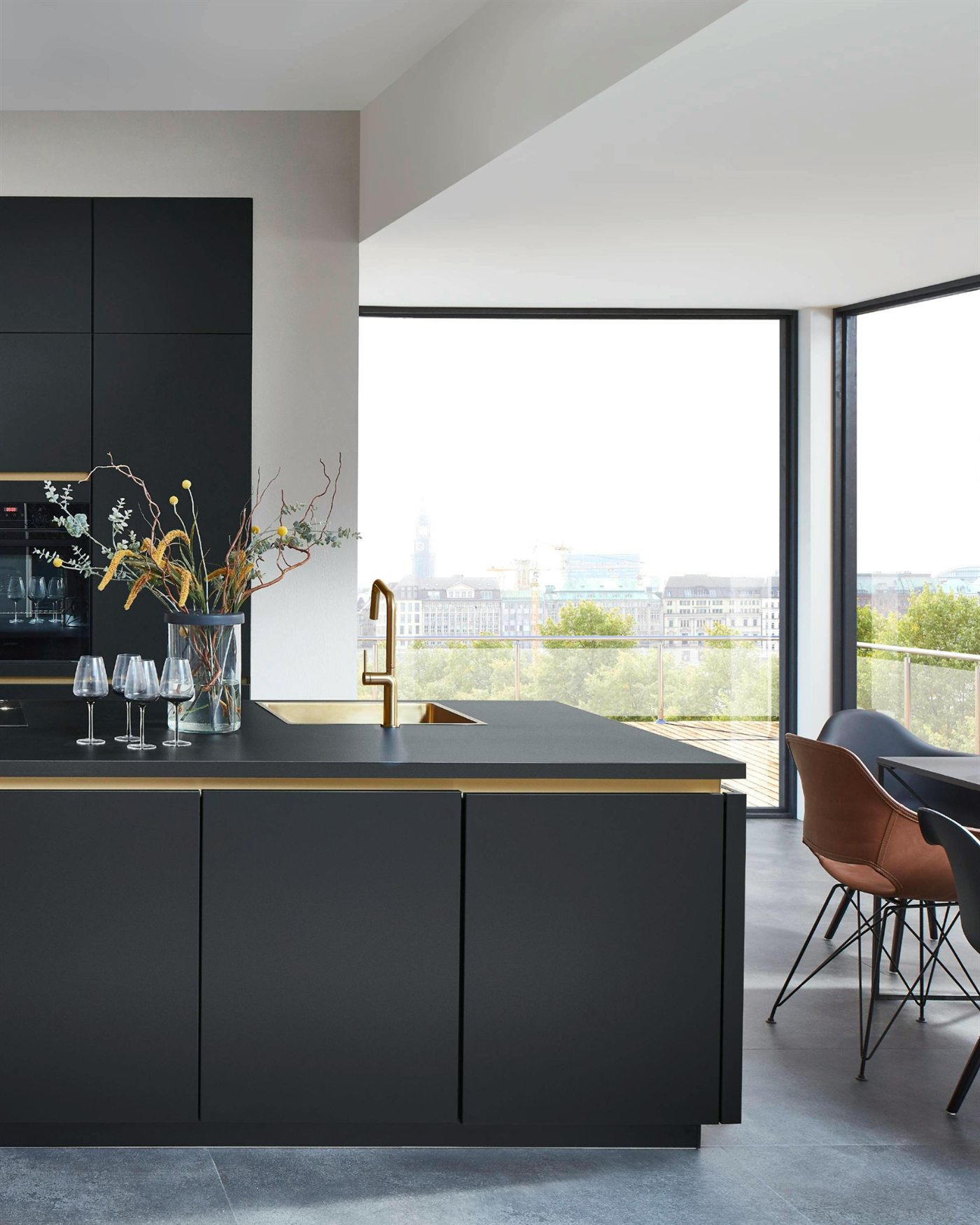 Interior design - finished kitchen with dark cabinetry and brass fixtures